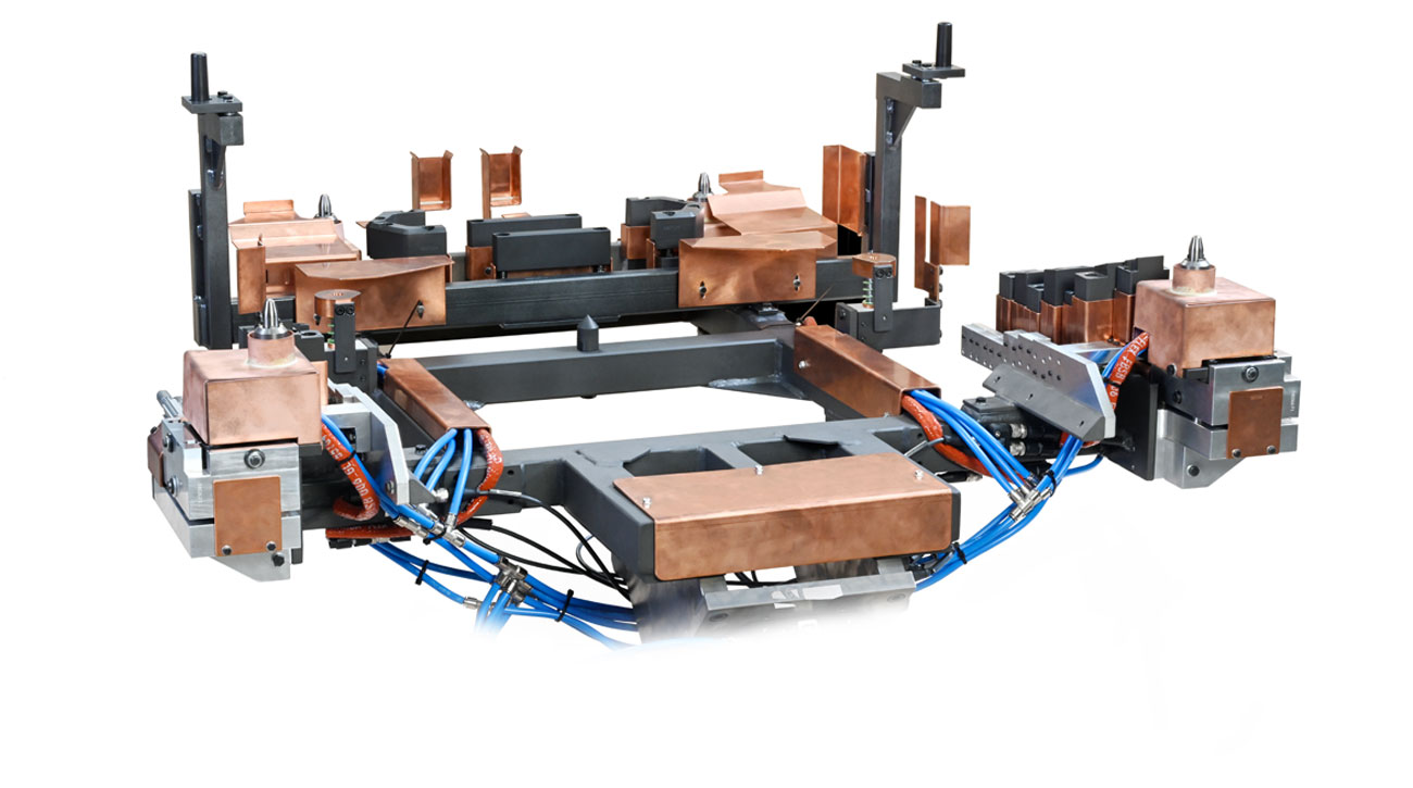 KOSMEK hydraulic fixtures and robotic gripper system at FLOW TECH for Nissan manufacturing.