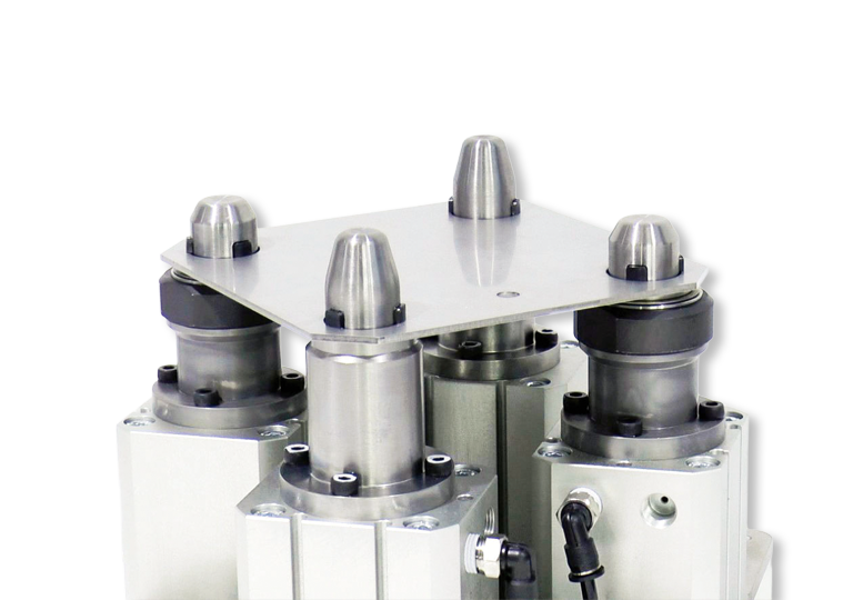 KOSMEK locating pin clamps for accurate workpiece positioning in welding or washing processes.