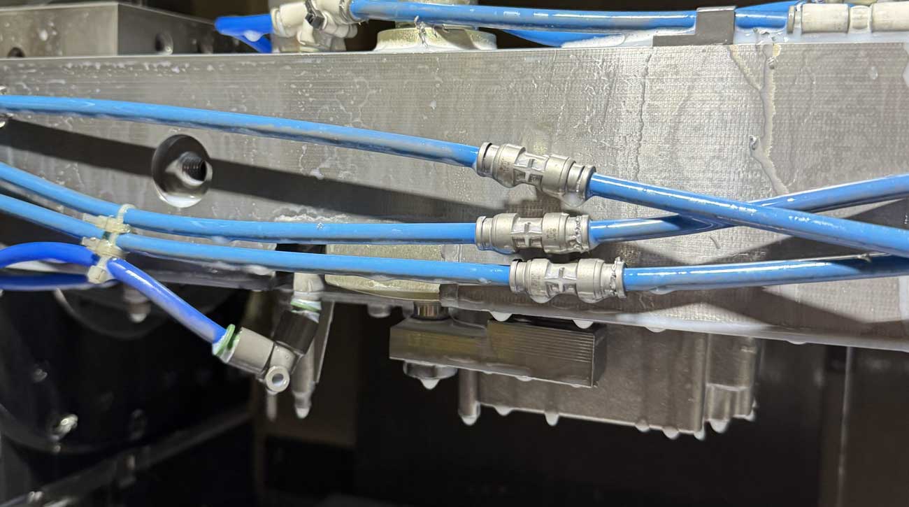 Close up of the High-Power Pneumatic Swing Clamp (WHE) lever securing the workpiece in a single setup machining fixture